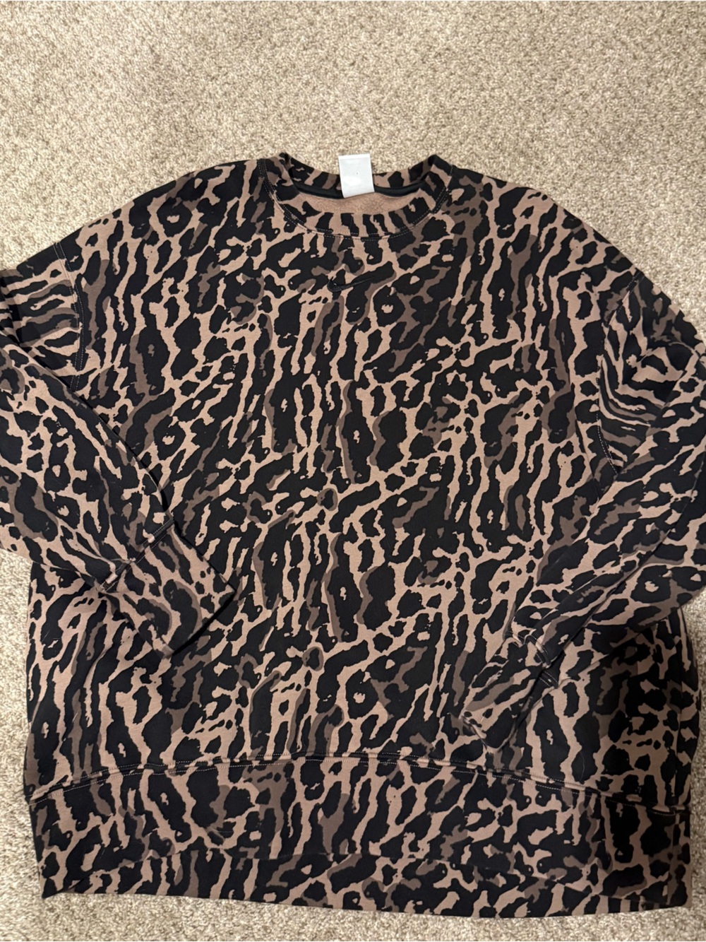 Nike Phoenix Women’s Animal Print Pullover Top in Black and Brown